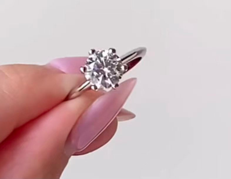 A slim, delicate band set with a single 3-carat six-prong diamond.
